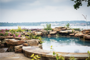 image of pool with plants around it trends in custom home design 2023